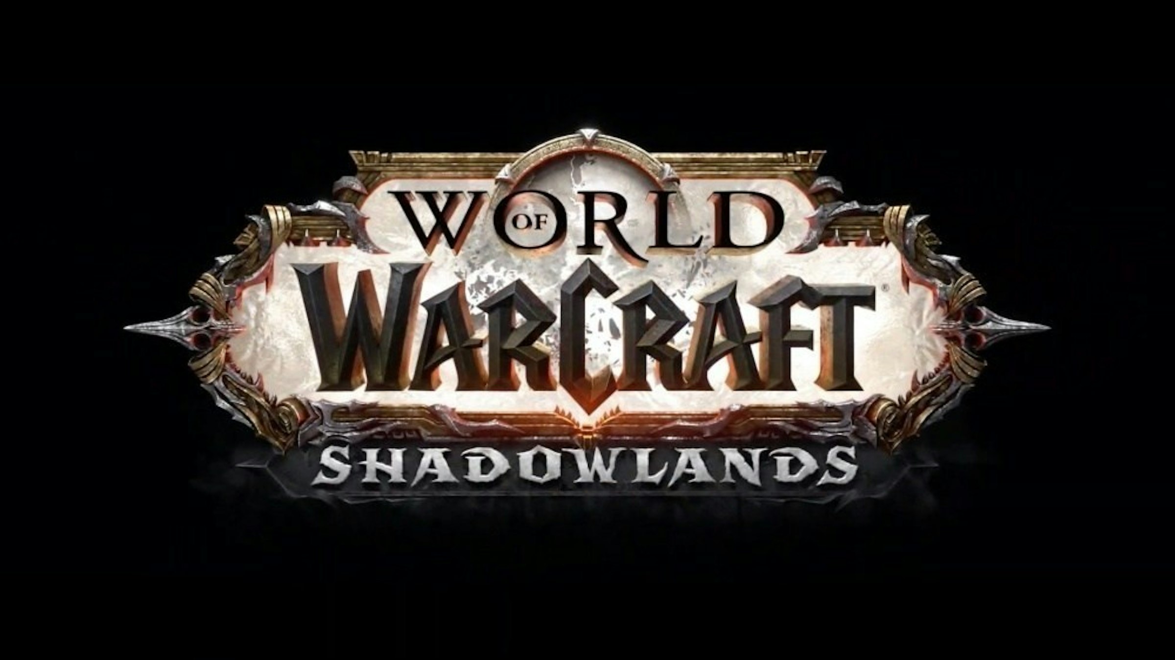 照片中提到了WORLD、WARCRAFT、SHADOWLANDS，跟魔獸世界有關，包含了圖形、商標、牌、字形、牆紙