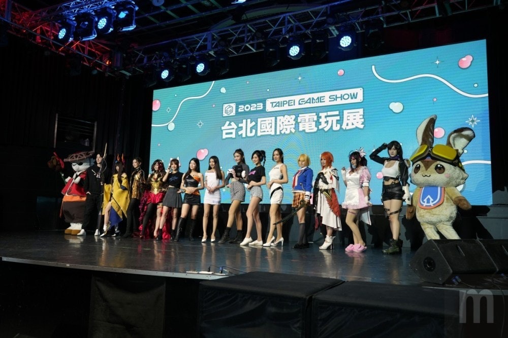 照片中提到了*、2023 TAIPEI GAME SHOW、台北國際電玩展，跟電影通行證有關，包含了階段、娛樂、娛樂、競爭、產品
