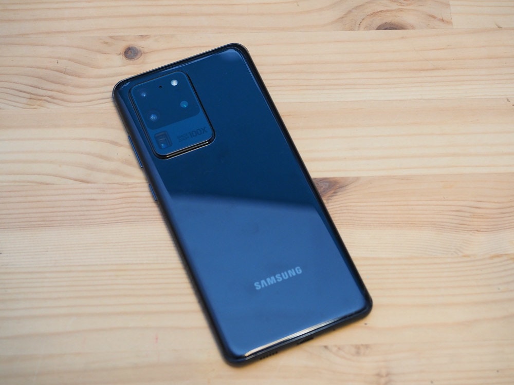 照片中提到了100X、SAMSUNG,跟三星集团有关,包含了功能手机、功能手机、手机、手机配件、蜂窝网络