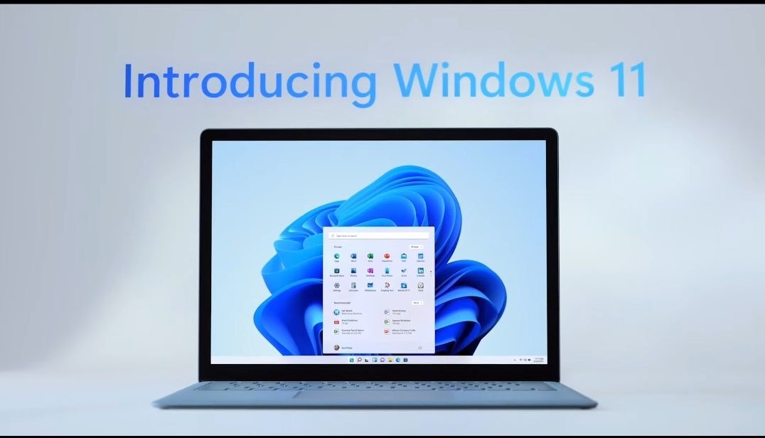 照片中提到了Introducing Windows 11，包含了通訊、輸出設備、電腦顯示器、多媒體、顯示裝置