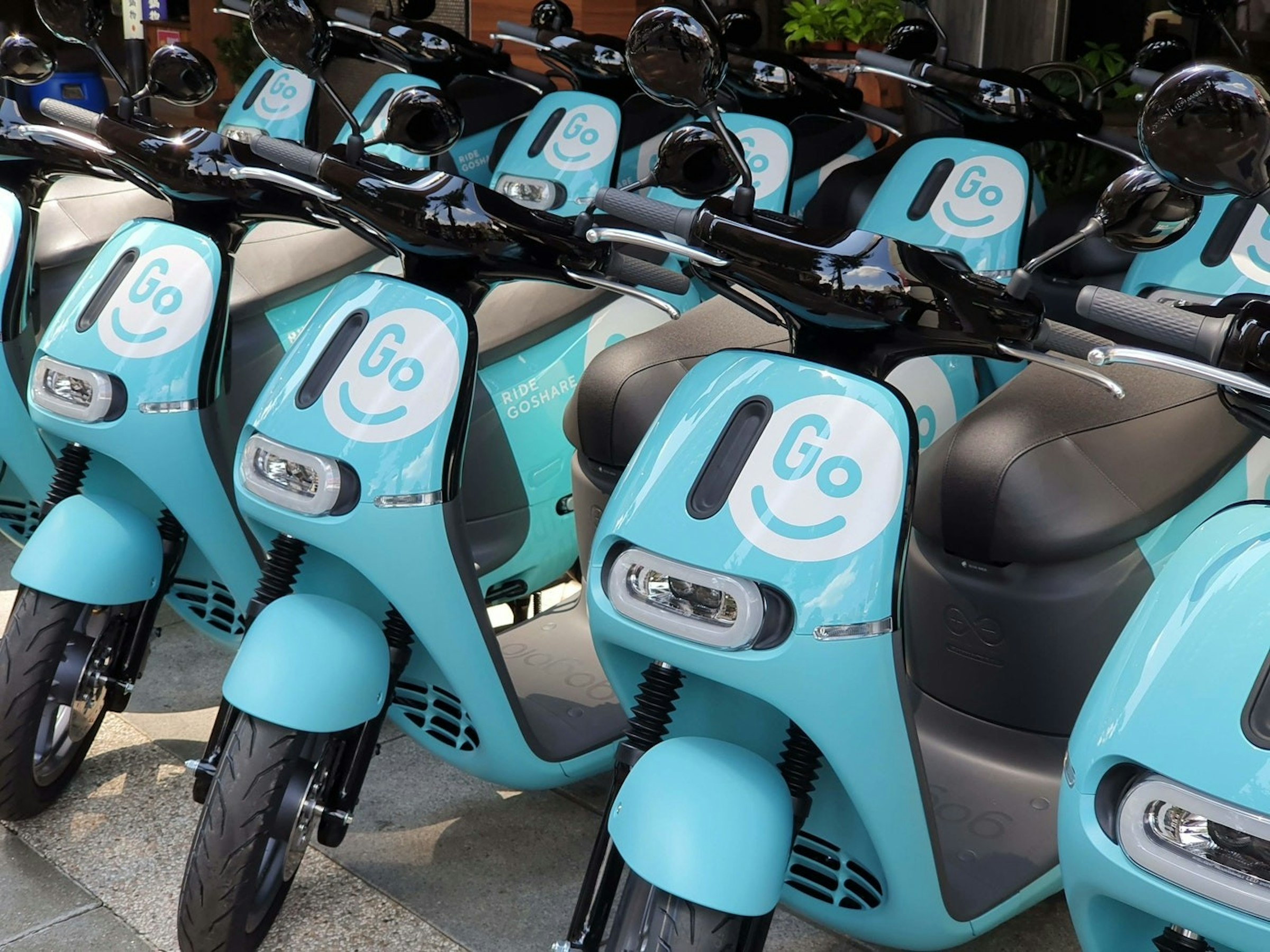 照片中提到了RIDE、GOSHA、Go，包含了goshare台北、汽車、摩托車、GoShare、電動摩托車和踏板車