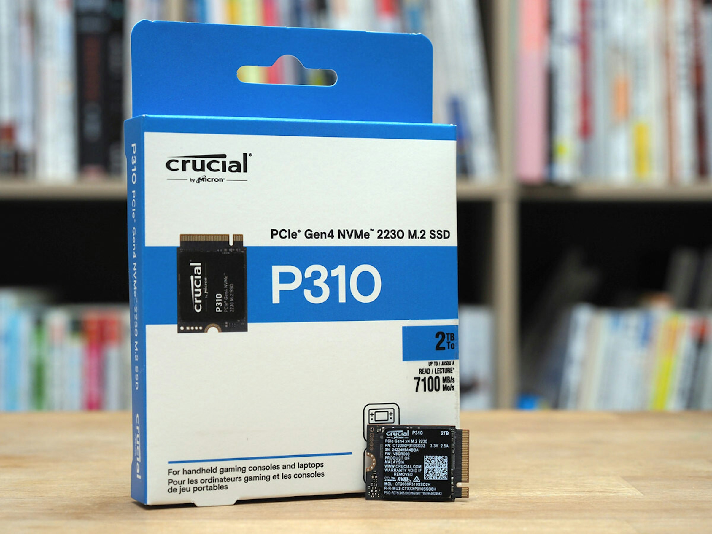 照片中提到了P310 PCIe Gen4 NVM 2230 M.2 SSD、crucial、by Micron，包含了紙箱、固態硬盤、Crucial 英睿達 P310 PCIe Gen4 NVMe 2230 M.2 固態硬碟、關鍵、菲生