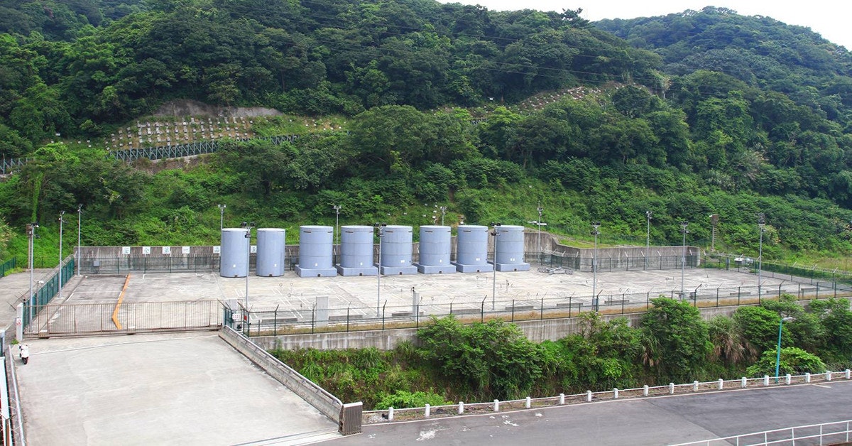 Jinshan Nuclear Power Plant, Dry cask storage, , Nuclear power, Taiwan Power Company, Nuclear power plant, Noble gas, Steel, Concrete, Reservoir, dam, Wall, Hill station, Infrastructure, Architecture, Tree, Reservoir, Road, Plant, Tourism, Dam