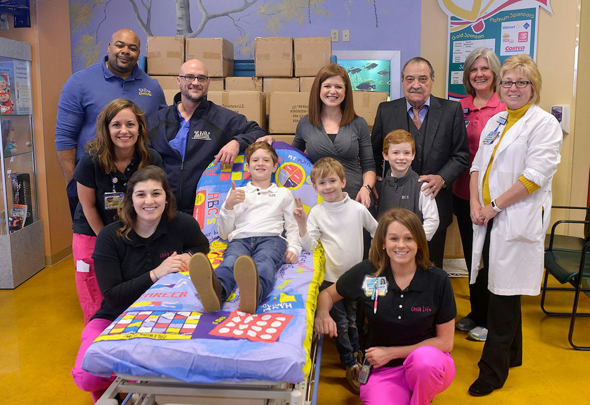 Hospital, Bed Sheets, Child, , Game, Board game, Bed, Adult, Boredom, Inpatient care, social group, People, Social group, Community, Event, Child, Party, Team, Kindergarten, Family, Birthday