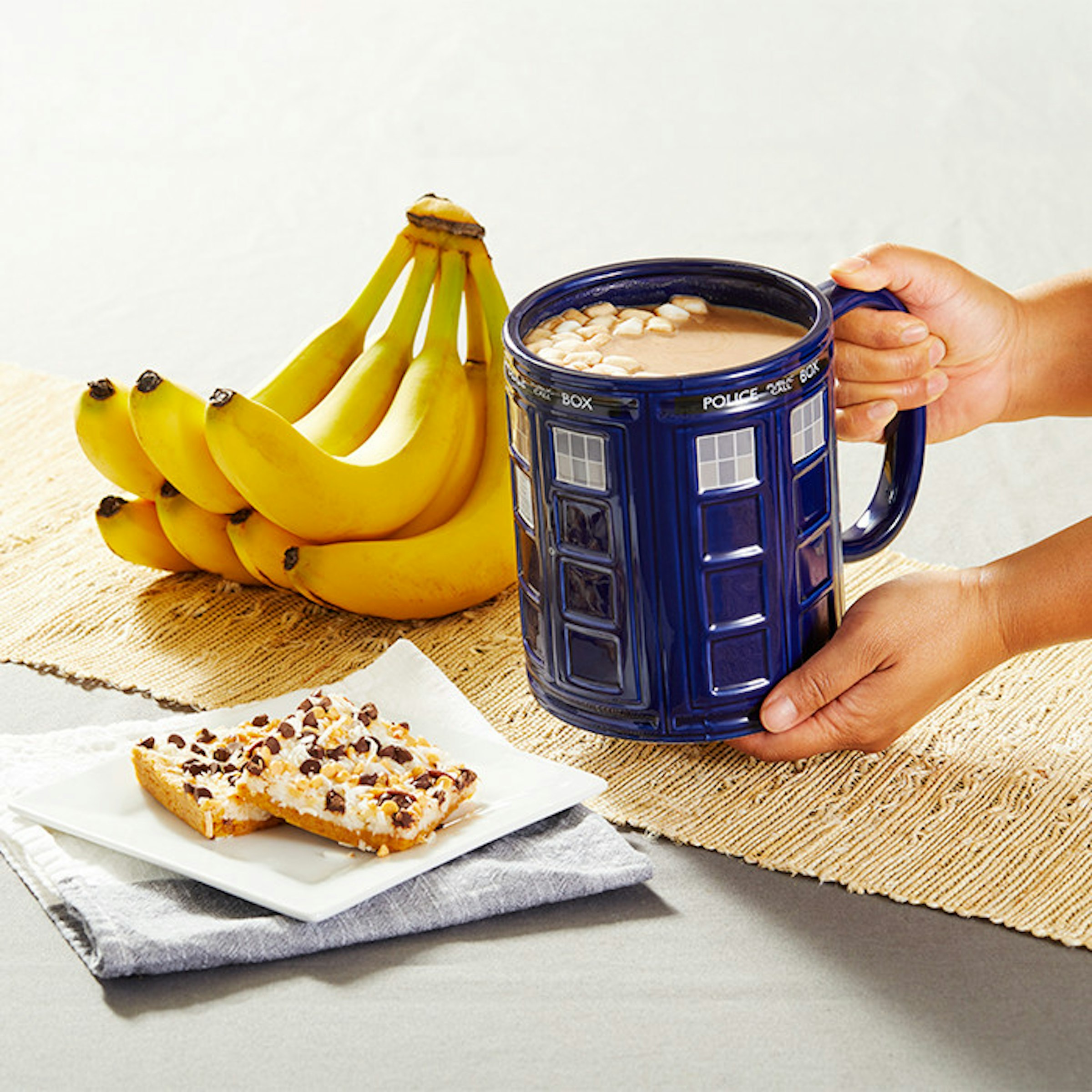 Mug, Food, Travel Mugs, Cup, Tableware, Tardis Mug, Table-glass, Kitchen utensil, ThinkGeek, Cutlery, food, Food, Ingredient, Junk food, Cuisine, Dish, Banana, Snack, Dairy, Dessert, Baked goods