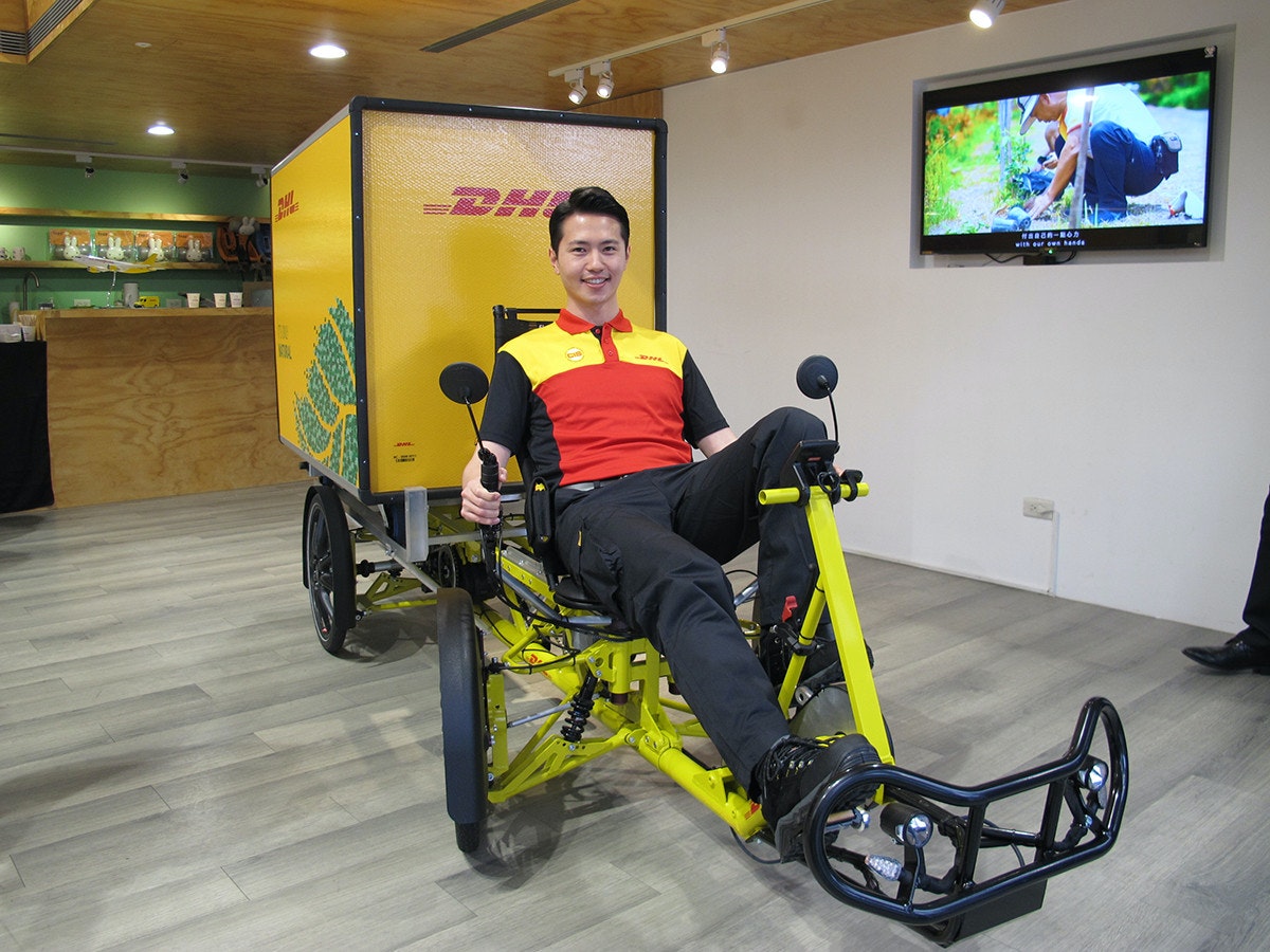 Car, Motor vehicle, Automotive design, Health, Vehicle, Design, Beauty.m, DHL EXPRESS, , dhl express, Product, Vehicle, Yellow, Bicycle, Exercise machine, Bicycle trainer, Exercise equipment, Recumbent bicycle, Room, Stationary bicycle